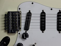 The bridge pickup is an original Seymour Duncan Hot Rails.  The neck and middle pickups are DiMarzio, of indeterminate type.