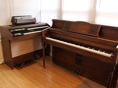 The piano corner. Complete with Henry F. Miller, Hammond Organ, and Magnus Mini Organ.