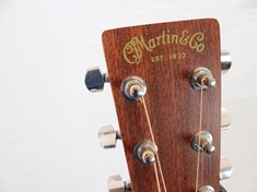 Ever since I bought my first Martin, I considered myself part of the Martin &amp; Co. family. This shot really shows off the beautiful wood grain on the head stock. I love the finish on this guitar